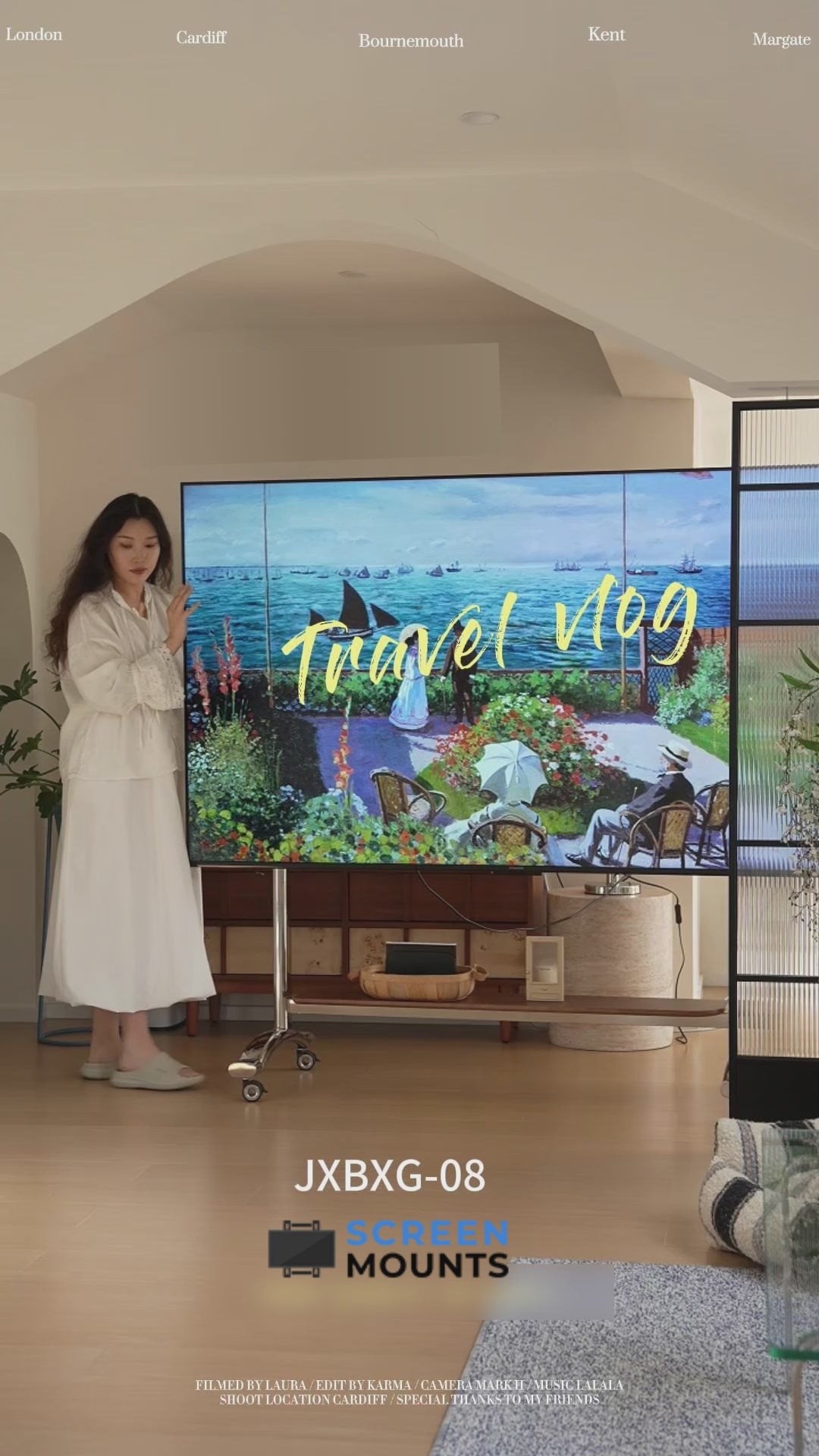 Load video: Forge Art Mobile TV TROLLEY stand Mount Bracket Stainless Steel with Timber Shelf 50 to 100 inch