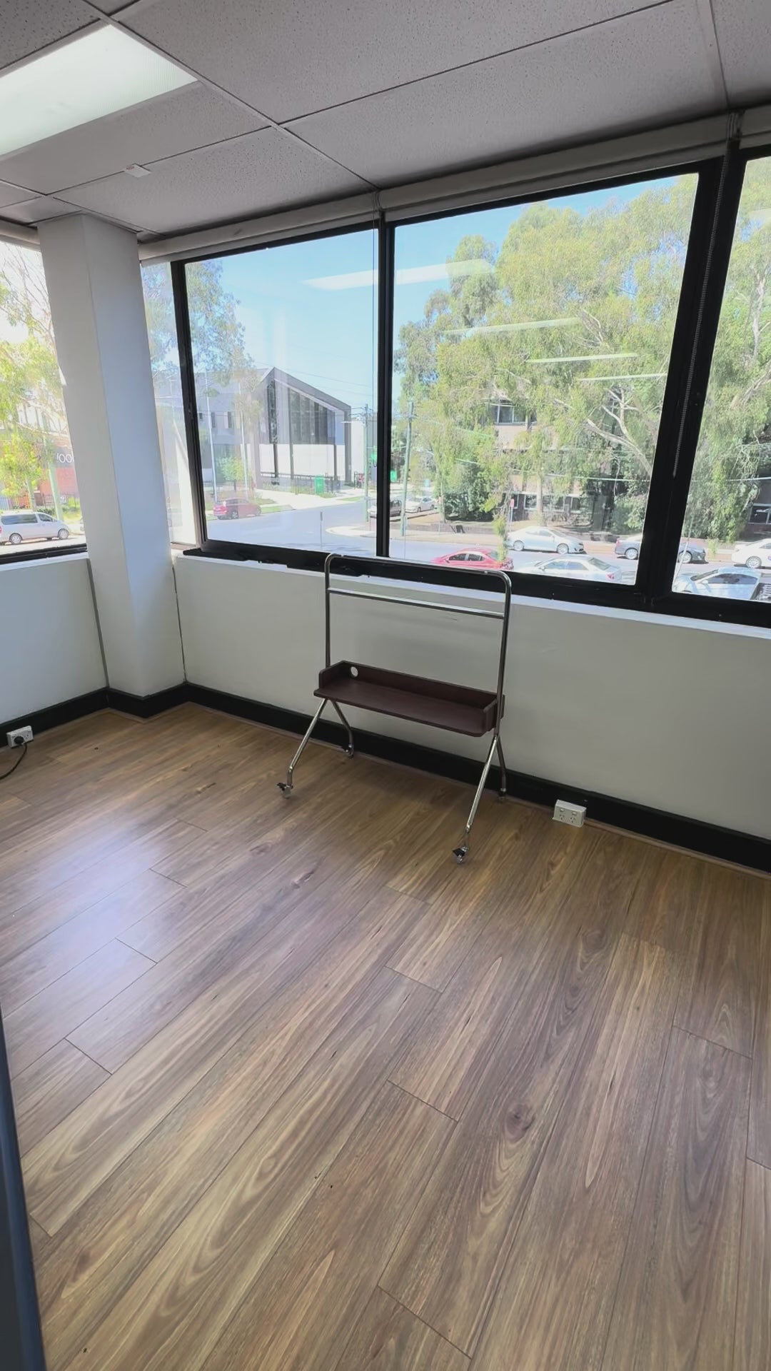 Load video: Nomad Solid Mobile TV TROLLEY stand Stainless Steel with Timber Shelf 32 to 75 inch